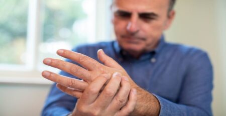 Mature Man Suffering With Repetitive Strain Injury