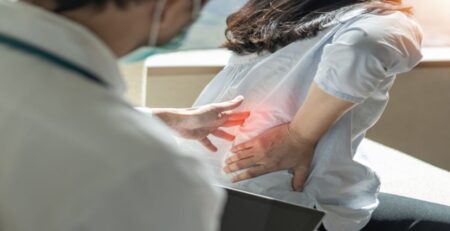 Woman Patient Visits a Doctor to Check Her Lower Back Pain